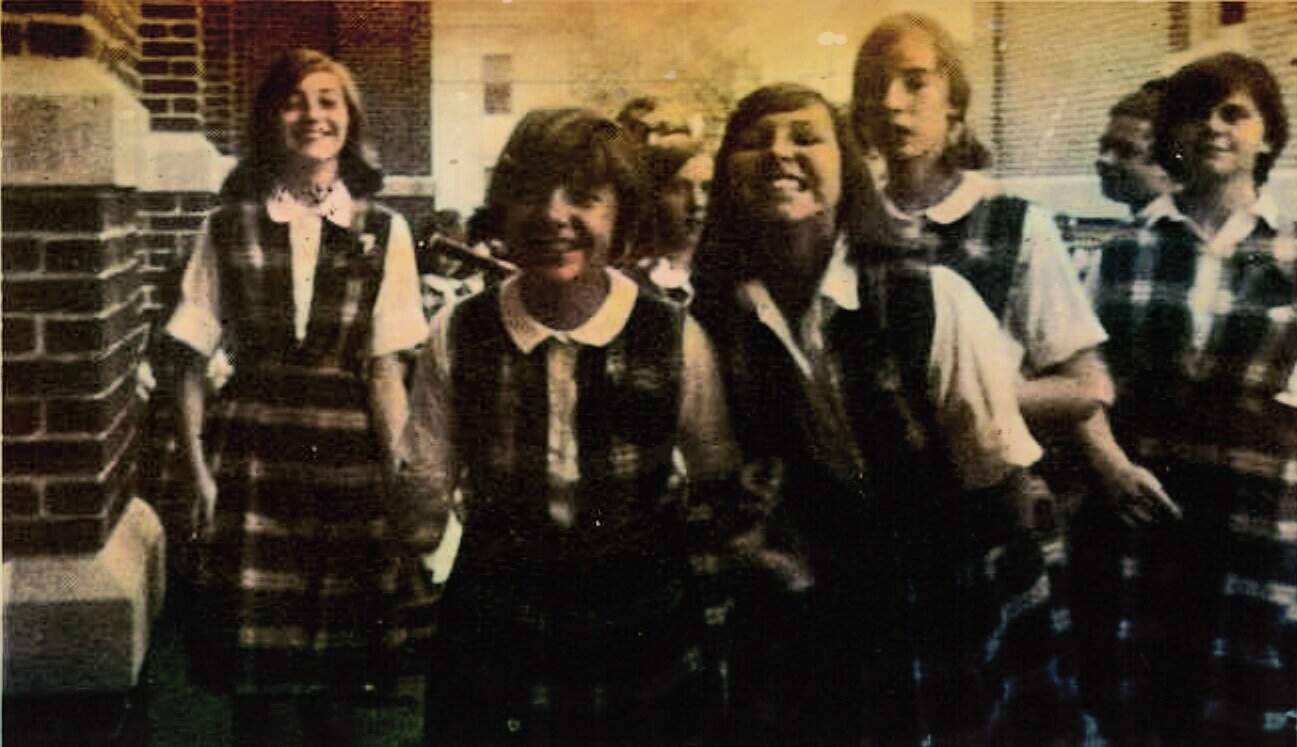 Students in school uniforms posing together in classroom, vintage photo, nostalgic education, classroom memories, childhood memories.