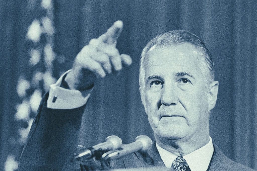 Past daily, sound archive, news, history, music, vintage photograph of John F. Kennedy giving a speech or address, archival image, historical figure, American history, political leader, famous speech, black and white photo, Cold War era, political history, Kennedy's presidency, iconic moment, media archive, oral history, broadcasting, presidential speech, historical documentation, notable public figure, media archive relevance.